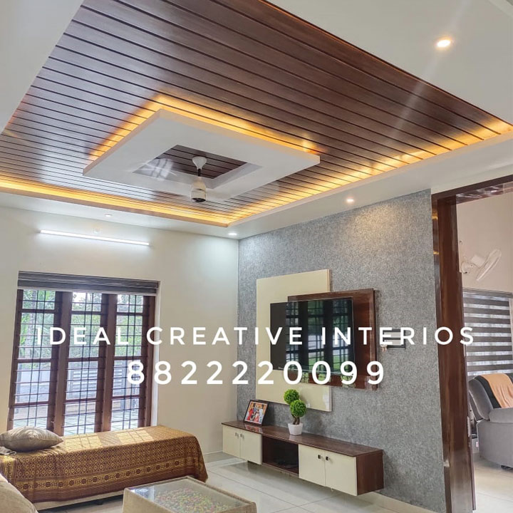 modern kerala style living room design with false ceiling and tv unit